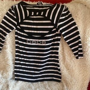 Bebe Black and White Striped Top with Rhinestone Logo. Sexy peephole opening.